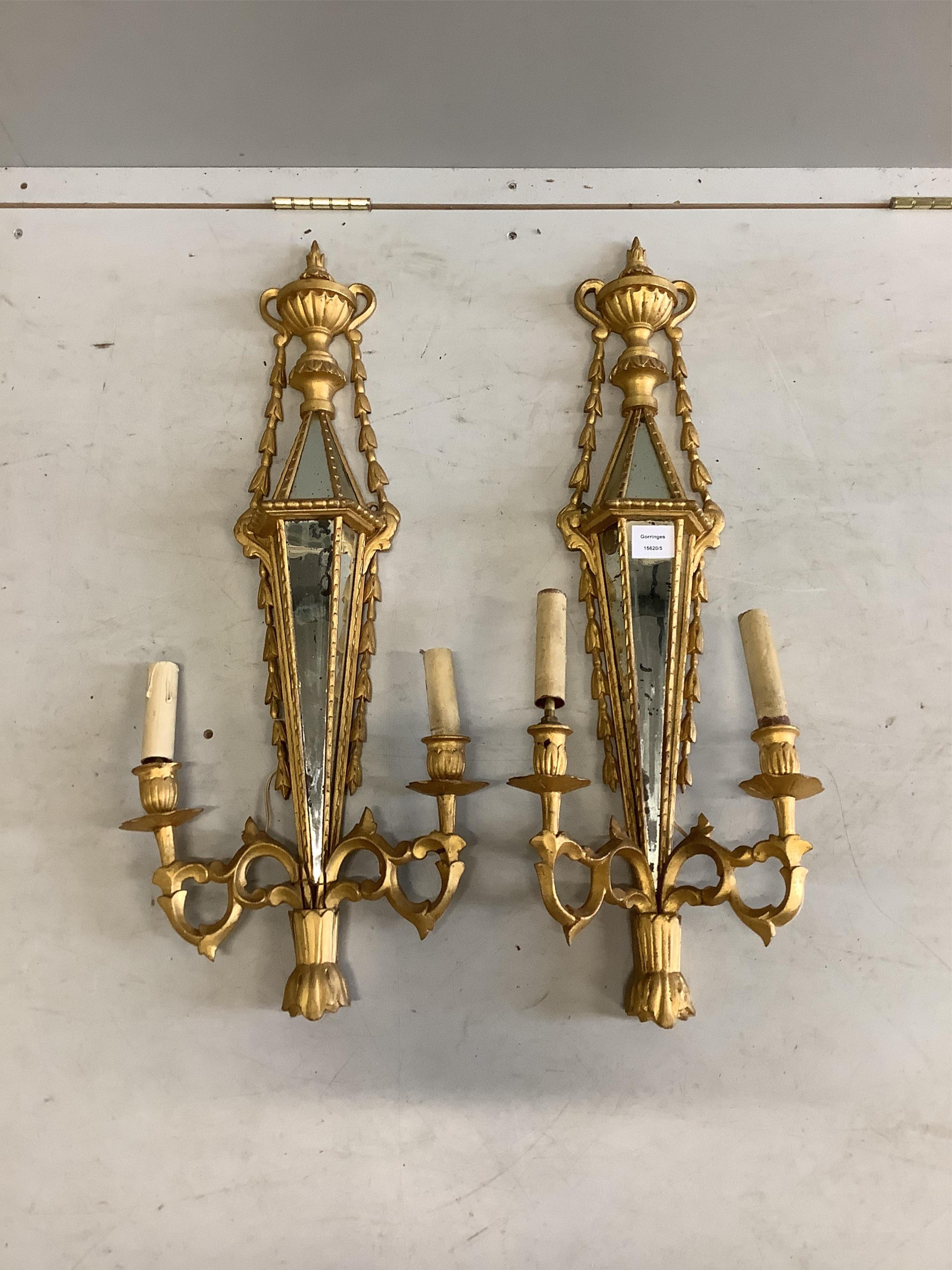 A pair of Venetian style mirrored giltwood and composition two branch wall lights, height 81cm. Condition - poor